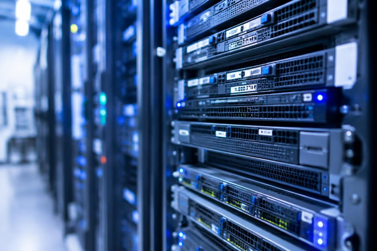 Rows of data centre servers lit in blue