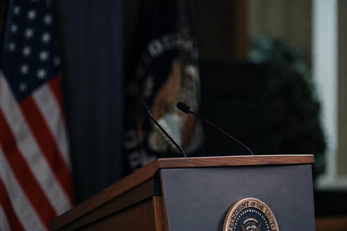 Empty government press briefing podium with microphones